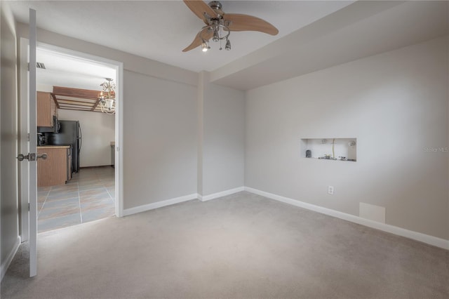 2614 E Liberty St, Tampa, FL 33612 - empty room featuring light colored carpet and a ceiling fan