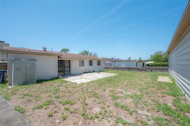 2614 E Liberty St, Tampa, FL 33612 - fenced backyard with a patio