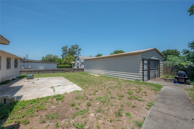 2614 E Liberty St, Tampa, FL 33612 - fenced backyard with a patio and an outbuilding