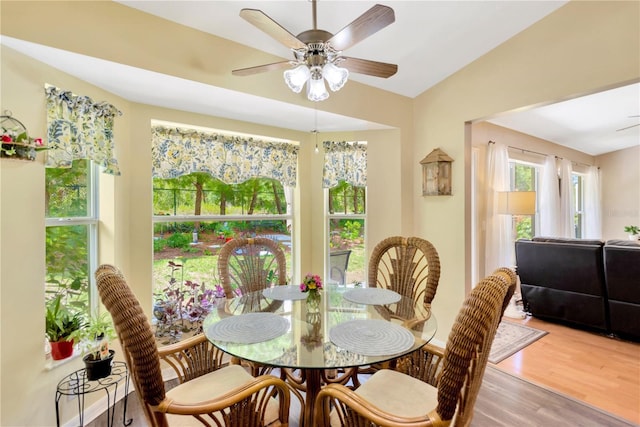 11148 Hollander Ave, Hudson, FL 34667 - dining room featuring light wood-style floors, a ceiling fan, and lofted ceiling