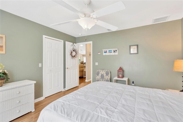 11148 Hollander Ave, Hudson, FL 34667 - bedroom featuring wood finished floors, baseboards, and a ceiling fan