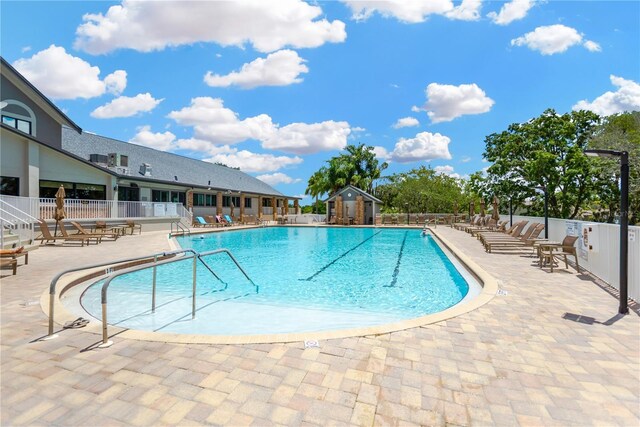 11148 Hollander Ave, Hudson, FL 34667 - community pool with fence and a patio