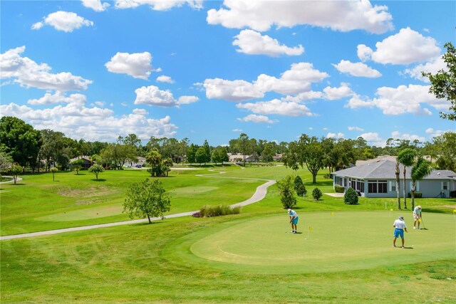11148 Hollander Ave, Hudson, FL 34667 - view of home's community featuring a yard, view of golf course, and a putting area
