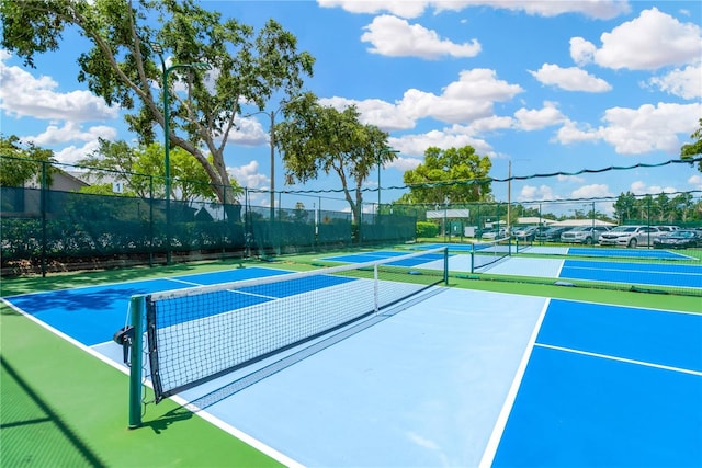 11148 Hollander Ave, Hudson, FL 34667 - view of tennis court with fence and community basketball court