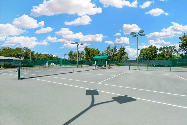 11148 Hollander Ave, Hudson, FL 34667 - view of tennis court featuring fence