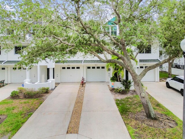 9812 Indian Key Trl Unit 84, Seminole, FL 33776 - view of property hidden behind natural elements featuring driveway