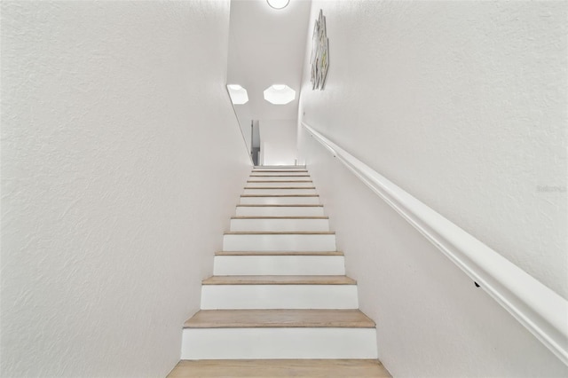 9812 Indian Key Trl Unit 84, Seminole, FL 33776 - stairs with wood finished floors