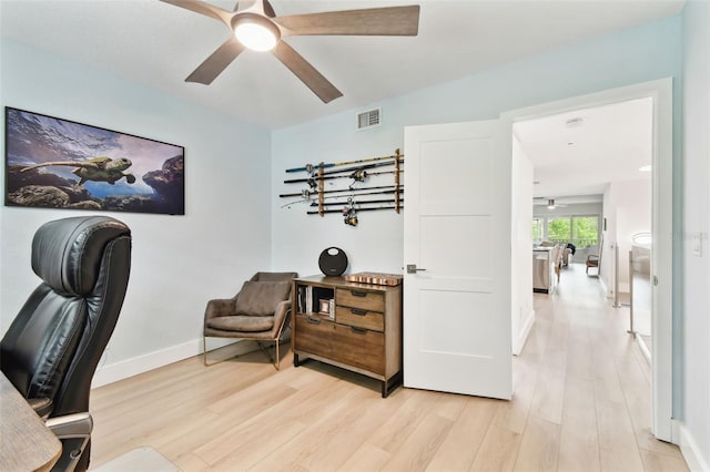 9812 Indian Key Trl Unit 84, Seminole, FL 33776 - home office featuring light wood-type flooring, ceiling fan, and baseboards