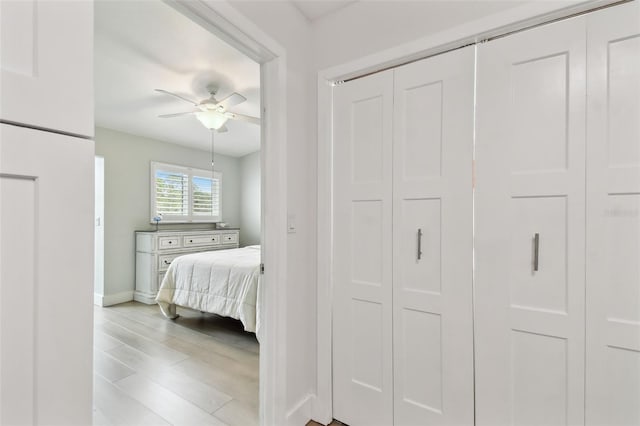 9812 Indian Key Trl Unit 84, Seminole, FL 33776 - bedroom with baseboards, ceiling fan, wood finished floors, and a closet