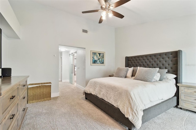 9812 Indian Key Trl Unit 84, Seminole, FL 33776 - bedroom with light colored carpet, baseboards, and ceiling fan