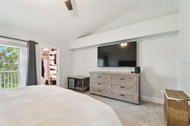 9812 Indian Key Trl Unit 84, Seminole, FL 33776 - bedroom featuring vaulted ceiling, light colored carpet, a walk in closet, ceiling fan, and baseboards