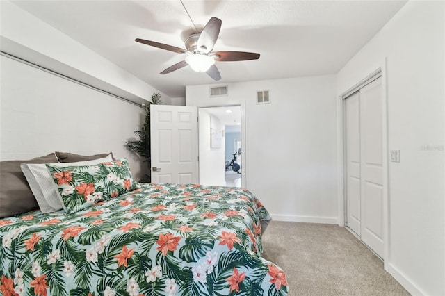 9812 Indian Key Trl Unit 84, Seminole, FL 33776 - bedroom featuring carpet, baseboards, ceiling fan, and a closet