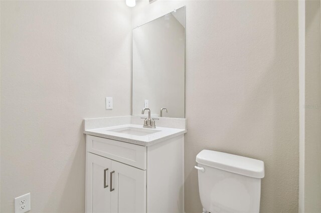 4709 Isonzo Way, Wesley Chapel, FL 33543 - half bath featuring vanity and toilet