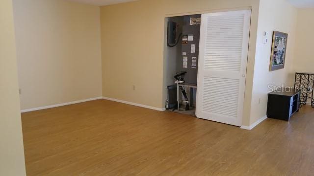 6263 Green View Cir Unit 107, Sarasota, FL 34231 - empty room featuring wood finished floors and baseboards