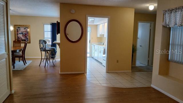 6263 Green View Cir Unit 107, Sarasota, FL 34231 - corridor featuring wood finished floors and baseboards