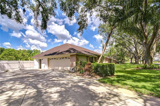 17917 Clear Lake Dr, Lutz, FL 33548 - view of property exterior featuring brick siding, driveway, and an attached garage
