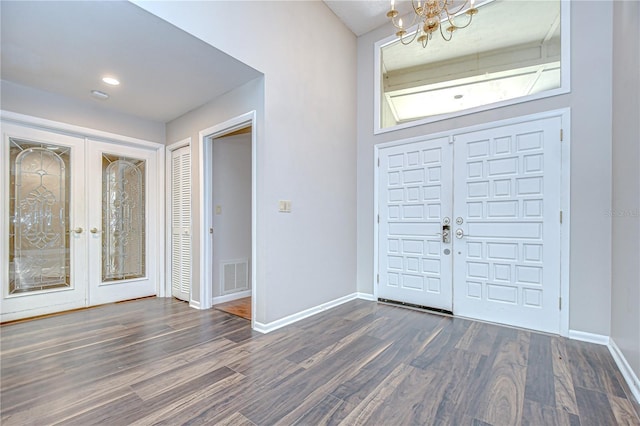 17917 Clear Lake Dr, Lutz, FL 33548 - entrance foyer featuring a chandelier, dark wood-style floors, french doors, and baseboards