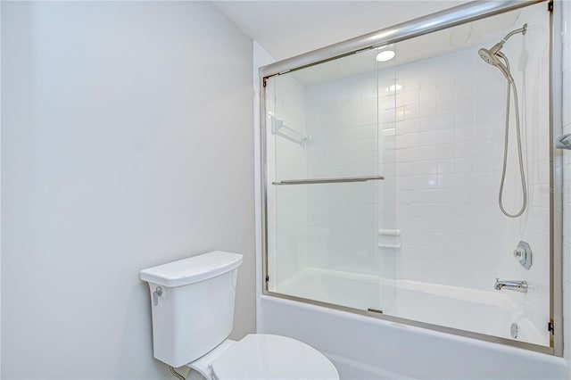 17917 Clear Lake Dr, Lutz, FL 33548 - bathroom featuring toilet and combined bath / shower with glass door