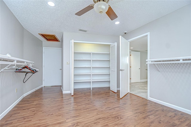 17917 Clear Lake Dr, Lutz, FL 33548 - walk in closet with wood finished floors and a ceiling fan