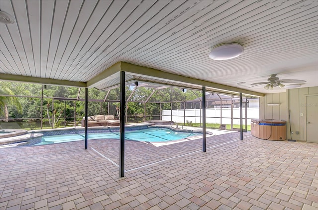 17917 Clear Lake Dr, Lutz, FL 33548 - view of pool with an in-ground hot tub, a patio area, a fenced backyard, ceiling fan, and a lanai