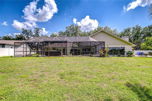 17917 Clear Lake Dr, Lutz, FL 33548 - rear view of house featuring a hot tub, glass enclosure, and a chimney