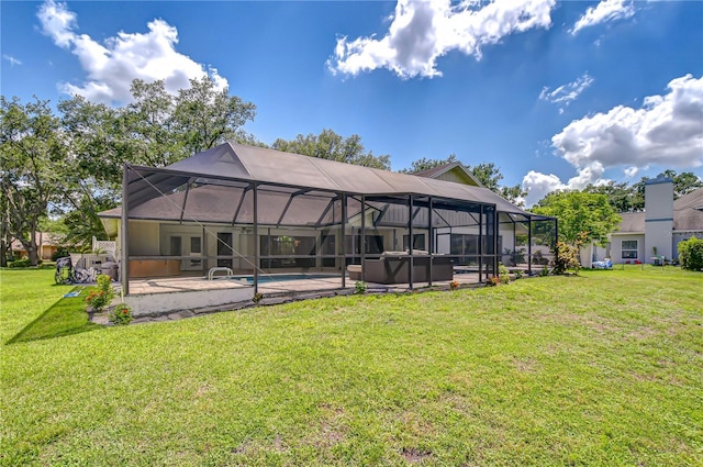 17917 Clear Lake Dr, Lutz, FL 33548 - back of house featuring a jacuzzi, a patio area, a yard, an outdoor pool, and glass enclosure