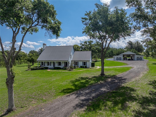 16326 Kalli Way, Dade City, FL 33523 - cape cod-style house featuring driveway, a front lawn, a carport, a chimney, and covered porch