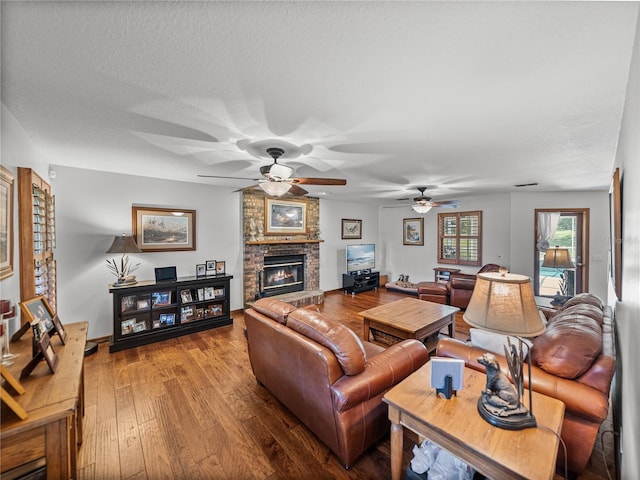 16326 Kalli Way, Dade City, FL 33523 - living area featuring a fireplace, hardwood / wood-style flooring, and ceiling fan