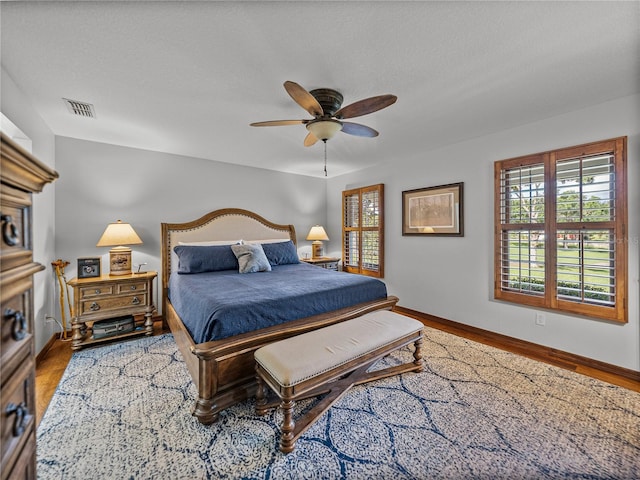 16326 Kalli Way, Dade City, FL 33523 - bedroom featuring wood finished floors, baseboards, and ceiling fan