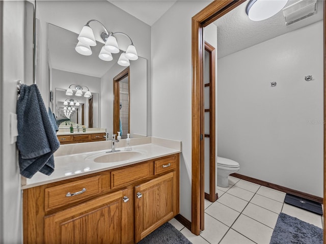 16326 Kalli Way, Dade City, FL 33523 - bathroom with toilet, vanity, tile patterned flooring, a chandelier, and baseboards