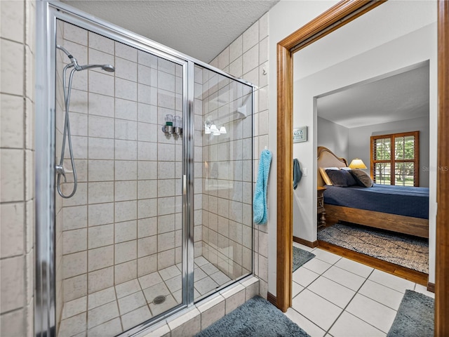 16326 Kalli Way, Dade City, FL 33523 - full bath featuring ensuite bath, a shower stall, a textured ceiling, tile patterned floors, and baseboards