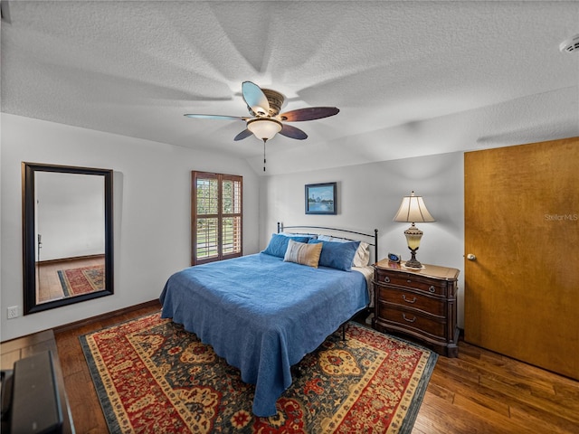 16326 Kalli Way, Dade City, FL 33523 - bedroom with a textured ceiling, wood finished floors, and a ceiling fan