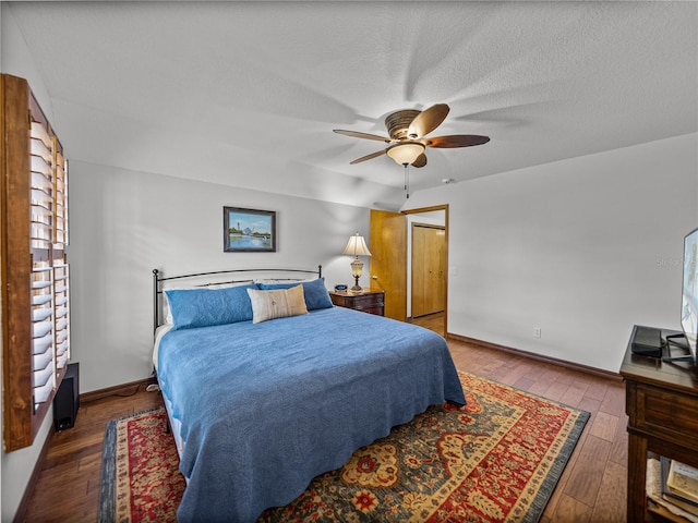 16326 Kalli Way, Dade City, FL 33523 - bedroom featuring hardwood / wood-style floors, baseboards, ceiling fan, and a textured ceiling