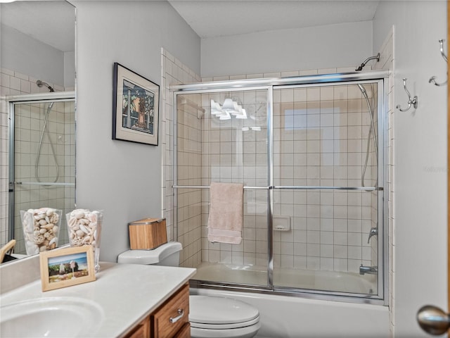 16326 Kalli Way, Dade City, FL 33523 - bathroom featuring vanity, toilet, and combined bath / shower with glass door