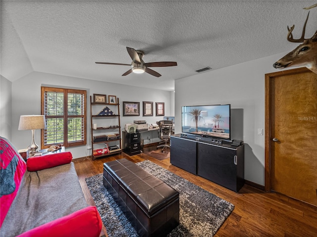 16326 Kalli Way, Dade City, FL 33523 - living room featuring a ceiling fan, an office area, wood finished floors, a textured ceiling, and vaulted ceiling