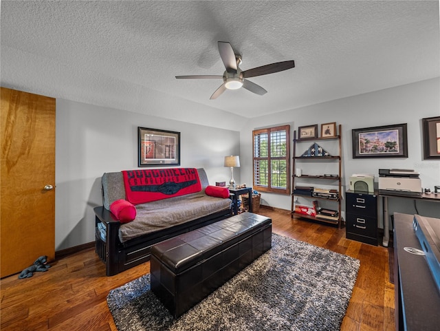 16326 Kalli Way, Dade City, FL 33523 - living room with a ceiling fan, a textured ceiling, wood finished floors, and baseboards