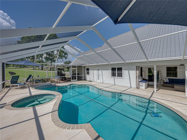 16326 Kalli Way, Dade City, FL 33523 - view of pool featuring a patio, a yard, glass enclosure, and a pool with connected hot tub