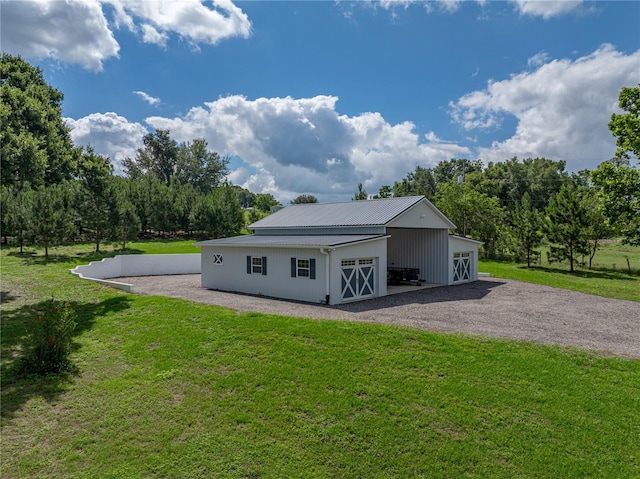 16326 Kalli Way, Dade City, FL 33523 - garage featuring driveway and view of scattered trees