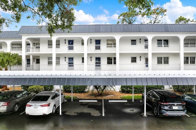 4801 Airport Rd Unit 210, Zephyrhills, FL 33542 - view of building exterior with covered parking