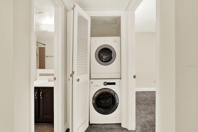 4801 Airport Rd Unit 210, Zephyrhills, FL 33542 - washroom with stacked washer / dryer, carpet floors, and baseboards