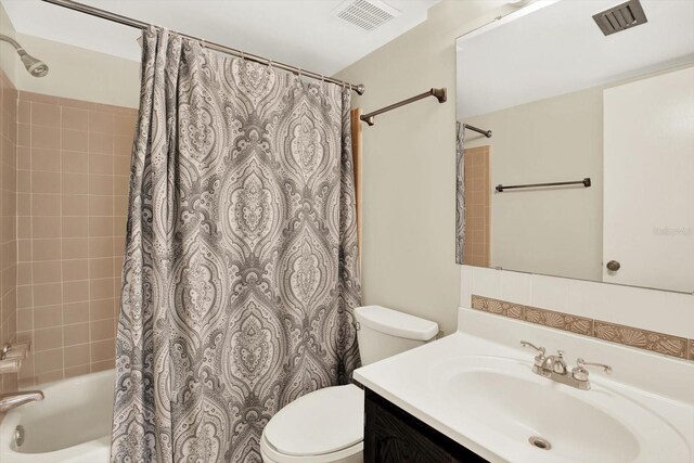 4801 Airport Rd Unit 210, Zephyrhills, FL 33542 - full bathroom featuring toilet, shower / tub combo, and vanity