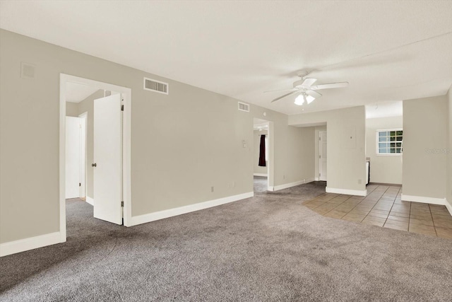 4801 Airport Rd Unit 210, Zephyrhills, FL 33542 - carpeted spare room with a ceiling fan, baseboards, and tile patterned flooring