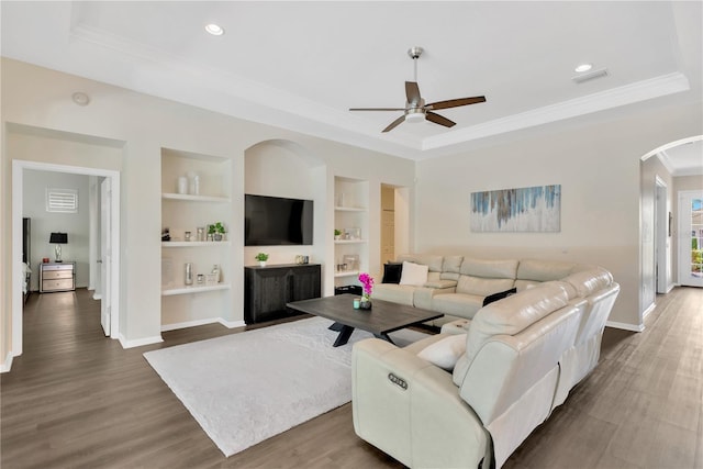13872 Siena Loop, Lakewood Ranch, FL 34202 - living room featuring arched walkways, a ceiling fan, built in shelves, baseboards, and ornamental molding