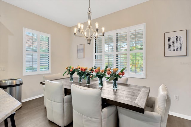 13872 Siena Loop, Lakewood Ranch, FL 34202 - dining room featuring a chandelier, baseboards, and wood finished floors