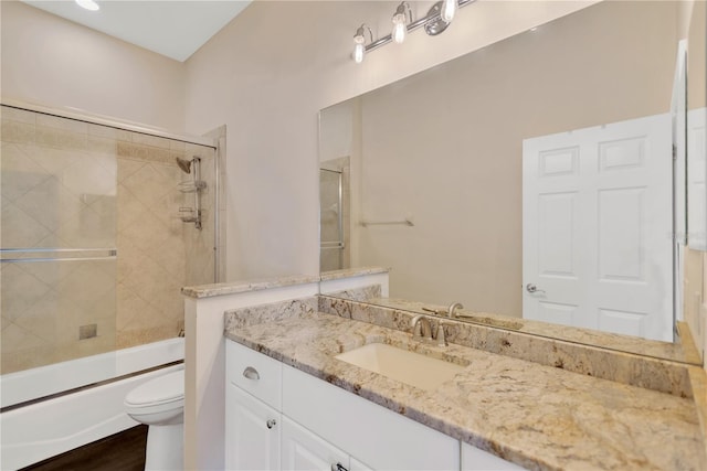 13872 Siena Loop, Lakewood Ranch, FL 34202 - full bathroom with vanity, toilet, shower / bath combination with glass door, and wood finished floors