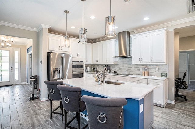 2515 63rd Ter E, Ellenton, FL 34222 - kitchen with wall chimney range hood, a sink, stainless steel appliances, baseboards, and ornamental molding