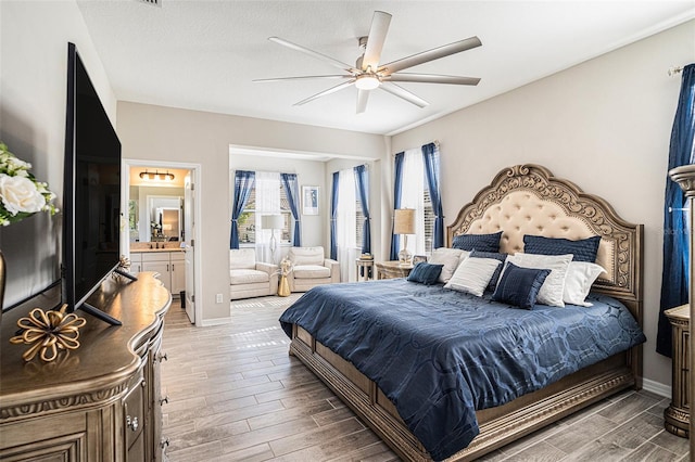 2515 63rd Ter E, Ellenton, FL 34222 - bedroom featuring wood finished floors, baseboards, ensuite bath, and ceiling fan