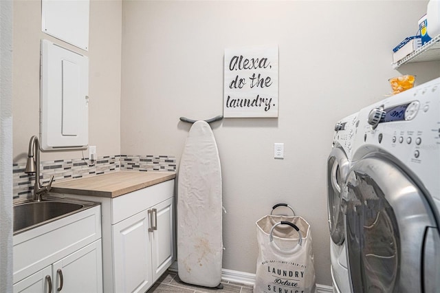 2515 63rd Ter E, Ellenton, FL 34222 - laundry room featuring cabinet space, washing machine and clothes dryer, and baseboards