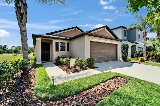 11121 Hudson Hills Ln, Riverview, FL 33579 - ranch-style house with stucco siding, a garage, and driveway