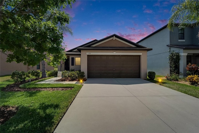 11121 Hudson Hills Ln, Riverview, FL 33579 - single story home featuring stucco siding, driveway, a garage, and a lawn